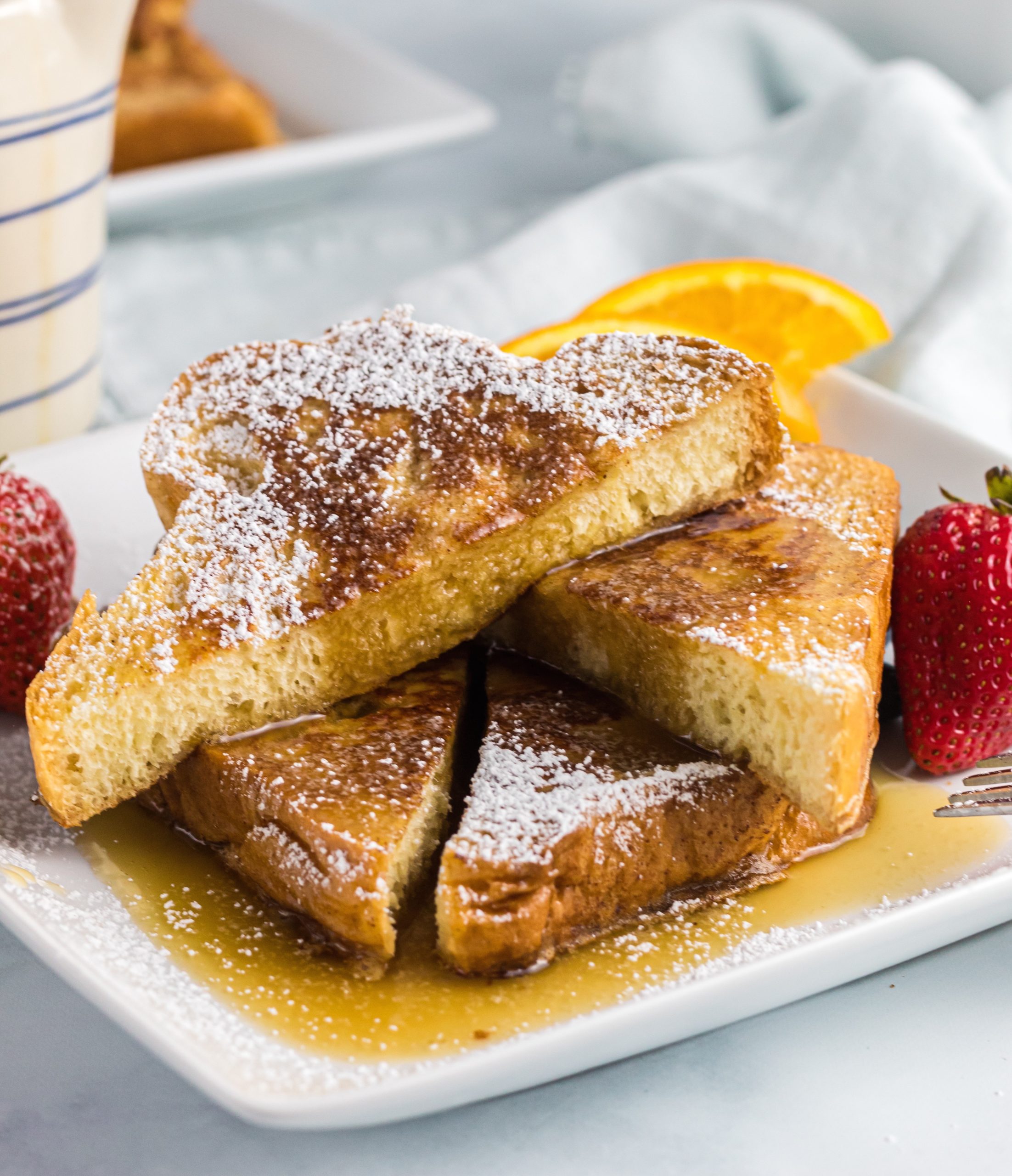 french toast with powdered sugar and syrup