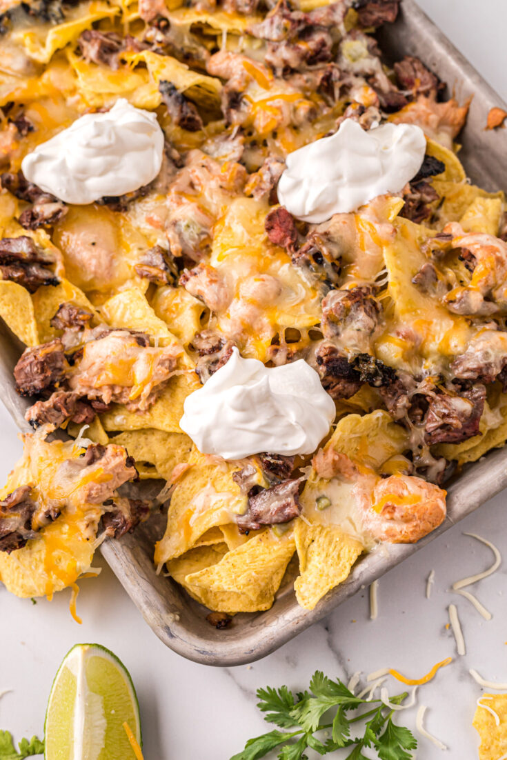 https://madeitateitlovedit.com/wp-content/uploads/2021/08/Carne-Asada-Nachos-18-scaled-735x1102.jpg